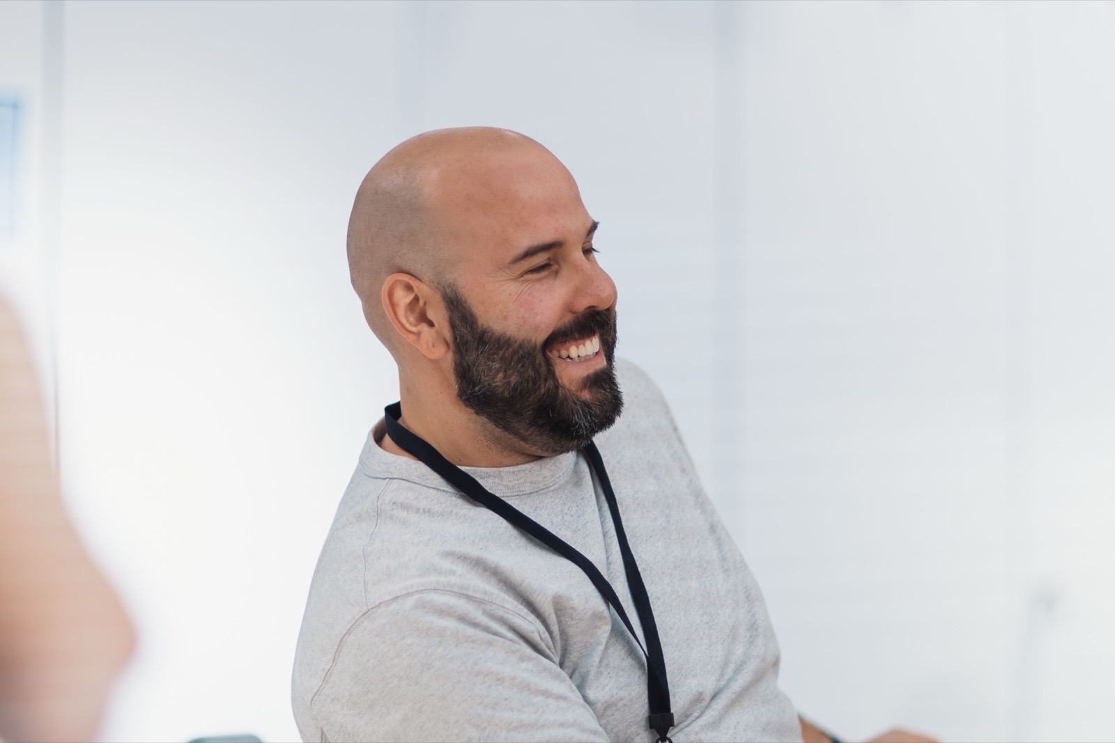 A business owner laughing during a meeting